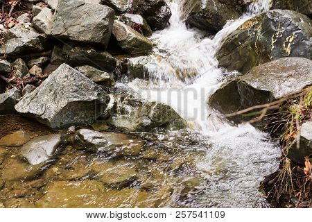Autumn Waterfall With Rocks And Leaves In Troodos Mountains In Cyprus