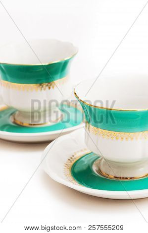Set Of Dishes On White Background. Green Indian Cups
