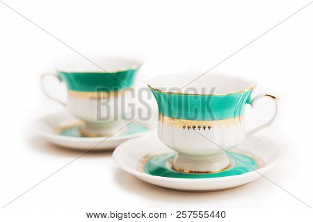Set Of Dishes On White Background. Green Indian Cups