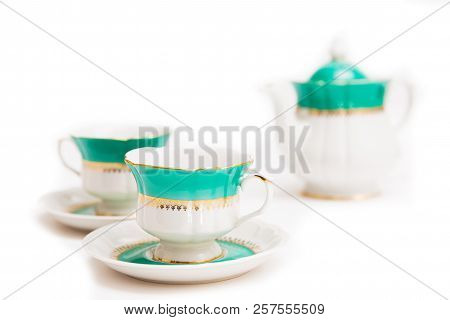 Set Of Dishes On White Background. Green Indian Cups And Kettle