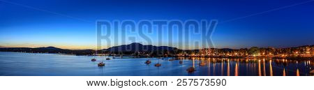 Magog, Province Of Quebec, Canada, September 2018. Magog Town At Night In Reflections Of Memphremago