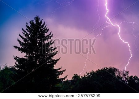 Thuderstorm. Lightning And Dark Clouds. Colorful Sky