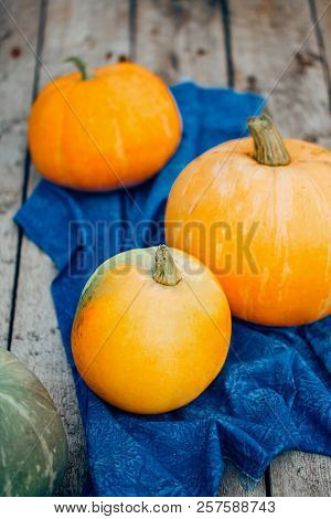 Autumn Pumpkin Thanksgiving Background - Orange Pumpkins Over Wooden Table