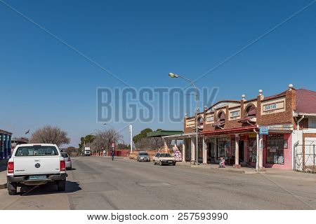 Koppies, South Africa, July 30, 2018: A Street Scene, With Businesses And Vehicles, In Koppies, A To