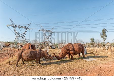 Pretoria, South Africa, July 30, 2018: Life Size Rhinos, Made From Tin Plate, For Sale Next To A Roa