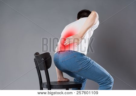 Back Pain, Kidney Inflammation, Man Suffering From Backache, Painful Area Highlighted In Red