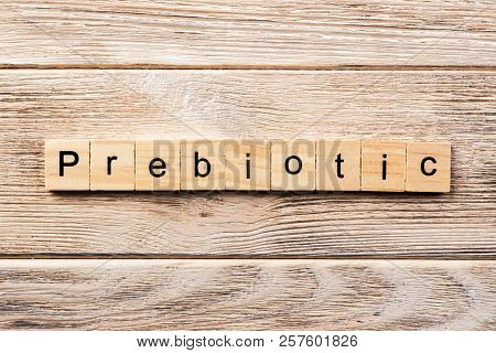 Prebiotic Word Written On Wood Block. Prebiotic Text On Table, Concept.
