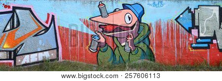 Full And Acomplished Graffiti Artwork. The Old Wall Decorated With Paint Stains In The Style Of Stre