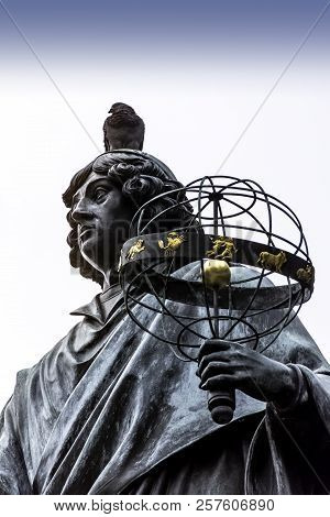 Torun, Poland - August 25: Pigeon Sitting On Copernicus Head - Nicolaus Copernicus Monument In The H