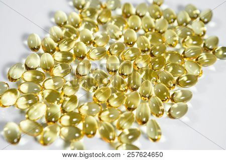 Fish Oil Supplement Capsules Isolated On White Background
