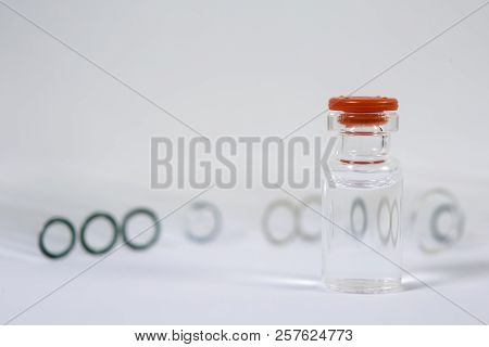 Group Of Vials With Medication On Blue Methacrylate Table. Horizontal Composition.