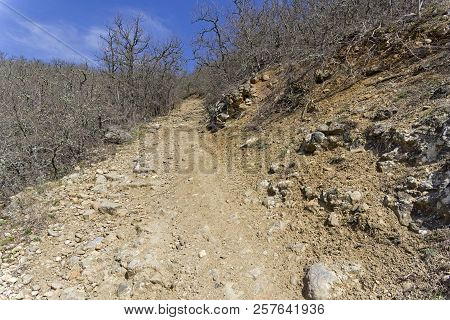 A Dirt Road On A Steep Slope. The Foot Of The Tokluk-syrt Mountain Ridge. Crimea, Spring, Early Apri