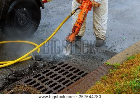Man At Work Breaking Asphalt On The Street Road Works Asphalt Removing