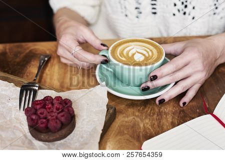 Having Lunch With Coffee Flat White And Sweet Chocolate Cookie In A Cafe Or Restaurant. Woman Hands 