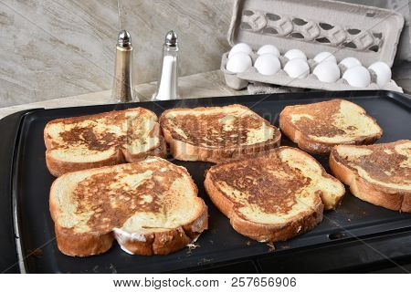 Thick French Toast Cooking On An Electric Grill