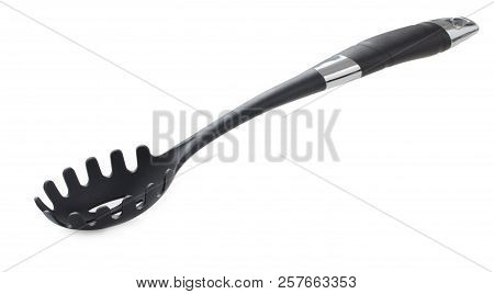 Black Plastic Spoon For Draining Of Spaghetti Isolated On White Background