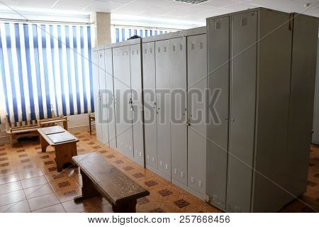Room, Locker Room For Workers With Individual Lockers For Changing Clothes In An Industrial Plant.