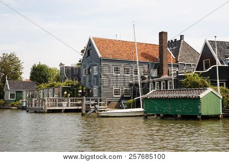 Traditional, Authentic Dutch Houses And Boat At The Canal.