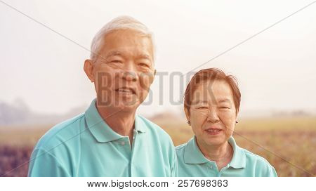 Asian Elderly Couple At Farm Rice Field Business Happy Nature Lifestyle