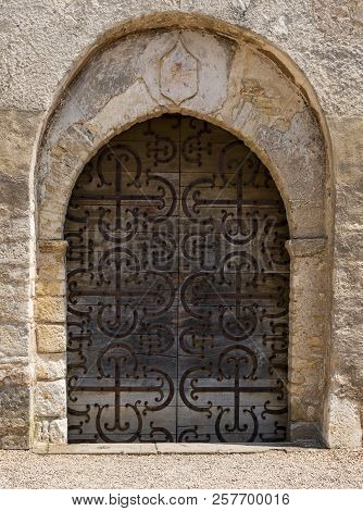 Old Wooden Church Door With Iron Decoration In Chazelle In The Morvan, France.