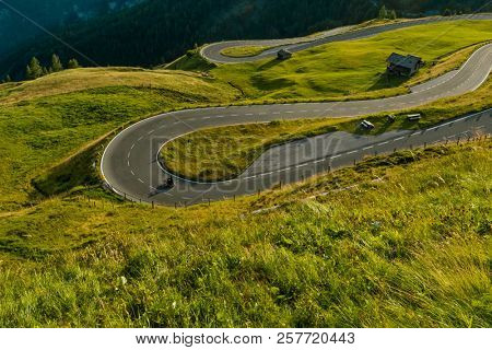 Motorcycle drivers riding in Alpine highway on famous Hochalpenstrasse, Austria, central Europe.
