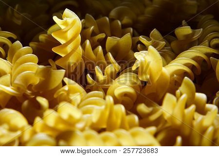 Raw Uncooked Dry Italian Fusilli Pasta. Corkscrew Spiral Shape
