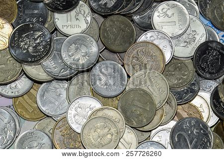 Russian Banknotes And Coins. A Handful Of Coins On New Russian Banknotes In Denominations Of 2000 An