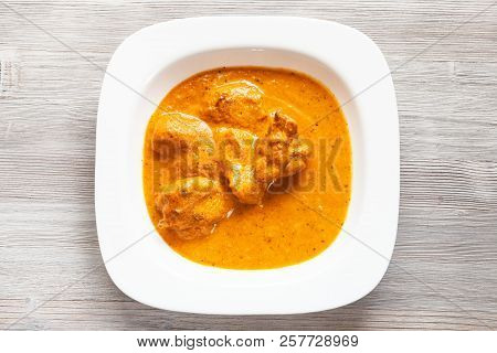 Indian Cuisine - Murg Makhan Masala Barbequed Chicken Pieces In Spicy Tomato And Creamy Curry Sauce 
