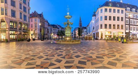 Stork Fountain On The Amagertorv Square, Stroget Street During Morning Blue Hour, Copenhagen, Capita
