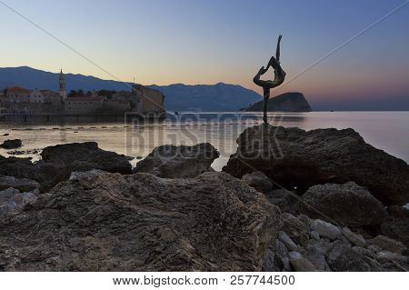 Budva, Montenegro - August 2018: A Ballet Dancer Statue In The Early Morning Standing On A Rock, A T