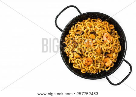 Traditional Spanish Fideua. Noodle Paella Isolated On White Background. Top View. Copyspace