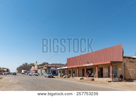 Koppies, South Africa, July 30, 2018: A Street Scene, With Businesses, People And Vehicles, In Koppi
