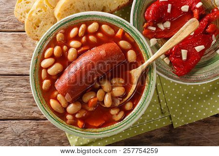 Pasulj (grah) Bean Soup With Sausage Is Served With Bread And Bell Pepper Close-up On A Plate. Horiz