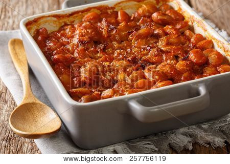 Delicious Prebranac Baked Beans With Onions Close-up On A Table. Horizontal