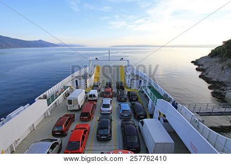 Merag, Croatia - May 18, 2010: Ferry Boat Loaded With Cars In Merag Port At Cres Island, Croatia.