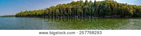 Panoramic View Of Lake Champlain Shore With Trees From A Boat