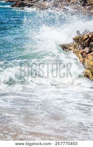 Island And Waves And Rocks