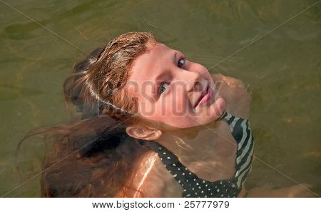 Cute 10 Year Old Girl Swimming Face Only Out Of Water