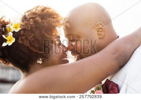 African American couple getting married at an island