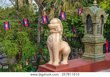Phnom Penh, Cambodia - April 8, 2018: A Guardian Lion Statue Or Leogryph In Front Of The Main Stupa 