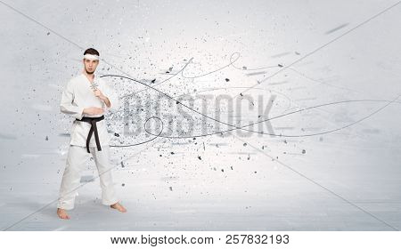 Young karate trainer doing karate tricks with chaotic concept