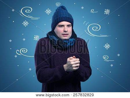 Young hipster frozen boy with doodled snowflakes and windy concept