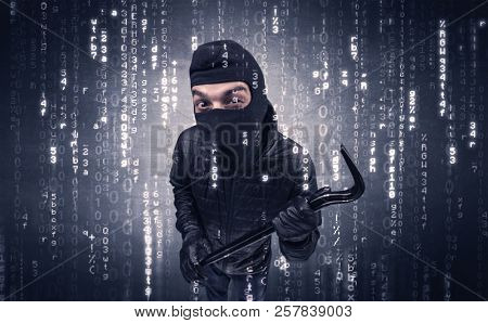 Burglar in action with encoded concept and his tools in his hand. 