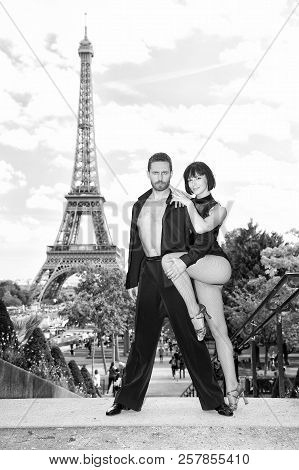 Dance Couple In Front Of Eifel Tower In Paris, France. Beatuiful Ballroom Dance Couple In Dance Pose