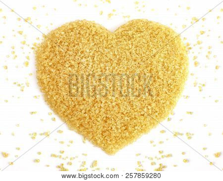 Heart-shaped Of Sugar From Sugarcane Top View, Background Granulated Sugar Yellow Brown, Sucrose Sug
