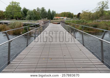 Wooden Bridge Over The River Tidan In Mariestad City Center