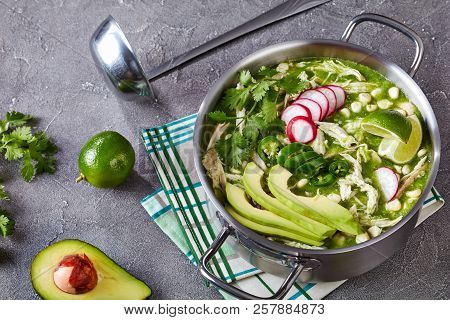 Pozole Verde In A Metal Casserole - Mexican Stew Filled With Shredded Chicken And Hominy In A Warm G