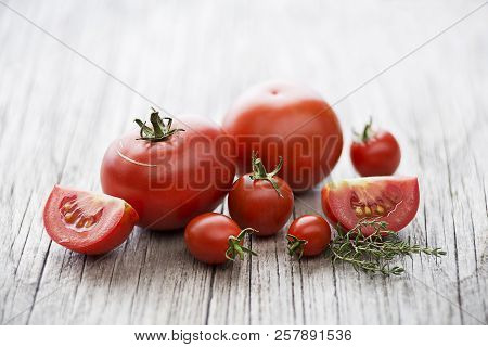 Fresh Tomatoes With Herbs. Concept For A Tasty And Healthy Meal.