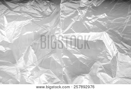 Crumpled Transparent Plastic  Surface In Black And White. Abstract Background And Texture For Design