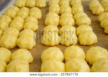 Cream Puffs Olso Known As Eclair In Tray.